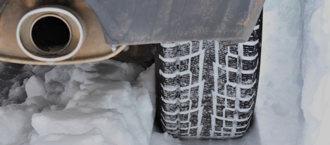 Car-Tire-Muffler-Close-Up-In-Snow