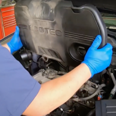 step-2-technician-removing-engine-cover