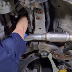 step-10-technician-installing-catalytic-converter-top-nut