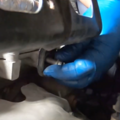 step-3-technician-removing-engine-cover-bracket